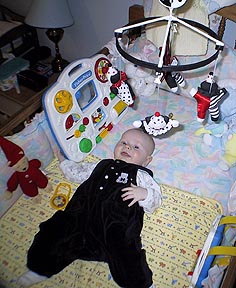 Playing in crib