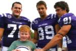 Samuel with Furman players after the game