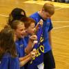 Samuel and other fifth graders carry the Livsey School banner in the opening ceremony parade