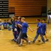Livsey School Science Olympiad team seated on basketball court at Druid Hills Middle School during opening ceremony