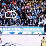 TV shot furnished by Bill Hines shows Edgar and GSU President Mark Becker at courtside