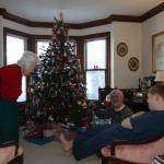 Grandmother, Samuel and Edgar preparing to open presents