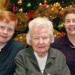 Samuel, Grandmother, and Julia at the Broadmore Assisted Living lobby Christmas tree, December 29, 2013