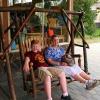 Samuel and Julia try out rocker at Canyon Visitor Center store