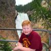 Samuel in front of Lower Falls of Yellowstone River from head of Uncle Tom's Trail