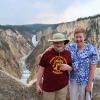 Samuel and Julia enjoy view of Lower Falls  and the Yellowstone River