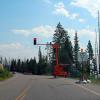 Weird portable traffic lights at washed out portion of two-lane road 