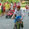 Sameul rides his bike in the parade