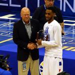 Commissioner Karl Benson presents first team Sun Belt trophy to Ryan Harrow