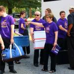 Mrs. Urda directs load-up for tour