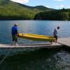 Uncle Edward and Samuel resurrecting Tom's old Snark sailboat at Lake Burton