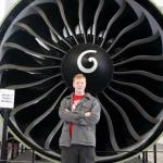 Sam stands in front of 747 engine at Future of Flight Museum  in Mukilteo, Washington