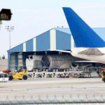Unloaded sections of 787 DreamLiner in hangar by DreamLifter, July 6, 2014