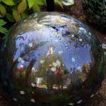 Reflection of Space Needle and  Edgar, Sam and Julia in glass ball at Chihuly Garden & Glass, July 6, 2014