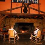Julia and Sam relax in front of main lobby fireplace at McDonald Lodge, July 8, 2014