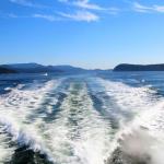 Boat picks up speed on the way to the whale pods in Puget Sound, July 12, 2014